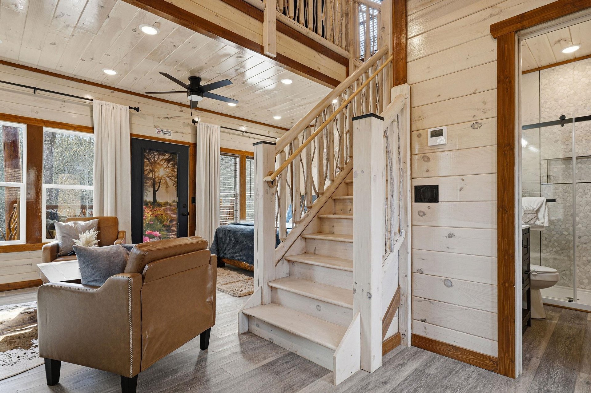 Unwind in your cozy cabin retreat with rustic charm, exposed beams, and comfortable seating perfect for relaxing after your adventures.
