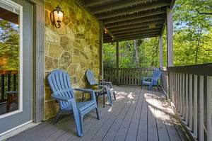 Relax in your private Adirondack chairs on the covered deck, surrounded by lush forest views.