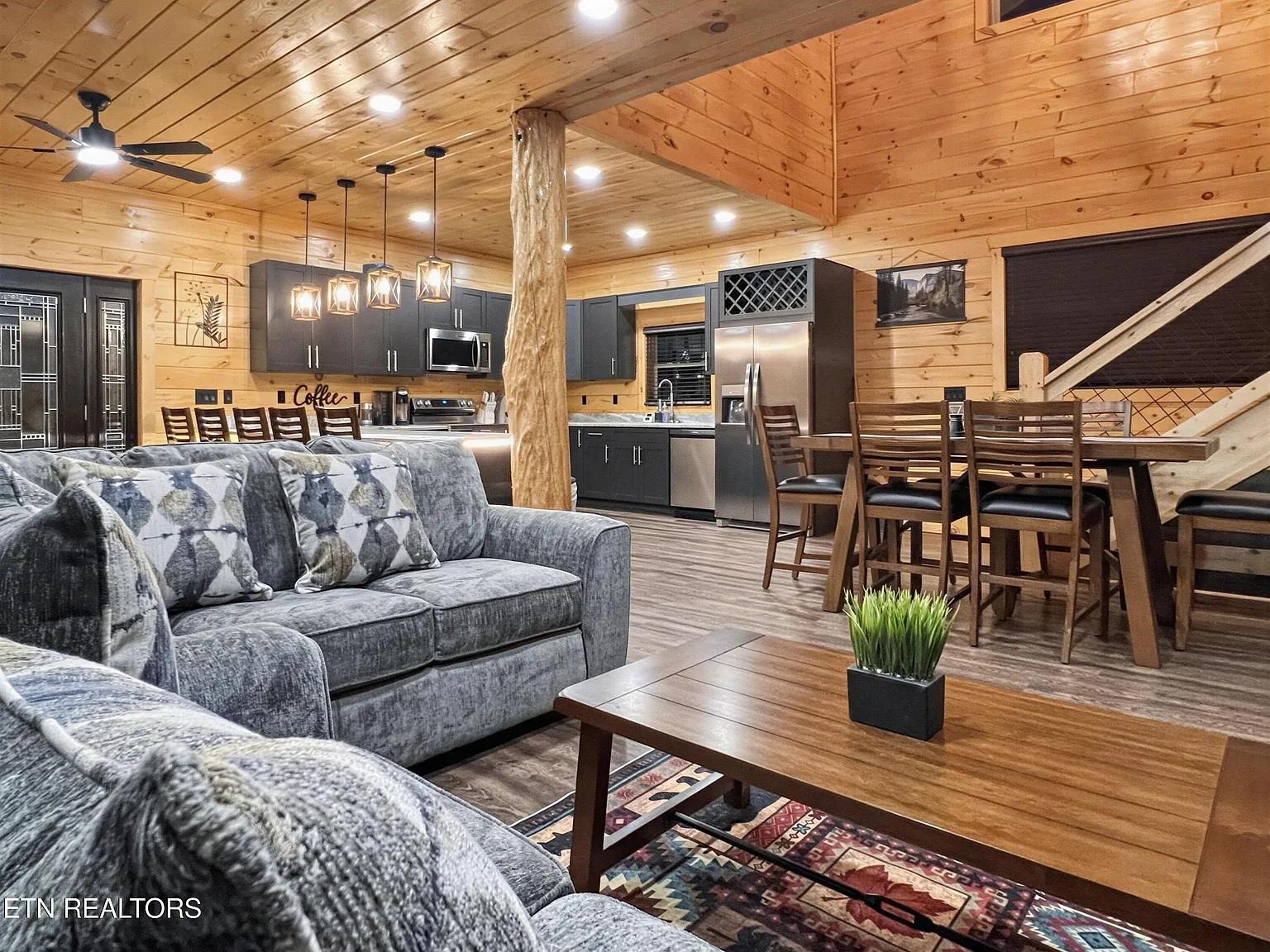 Sink into plush seating while enjoying your fully equipped kitchen, perfect for cozy evenings in your mountain retreat.