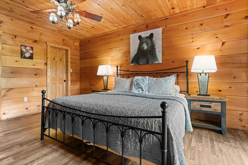 King bed with bear picture on wall