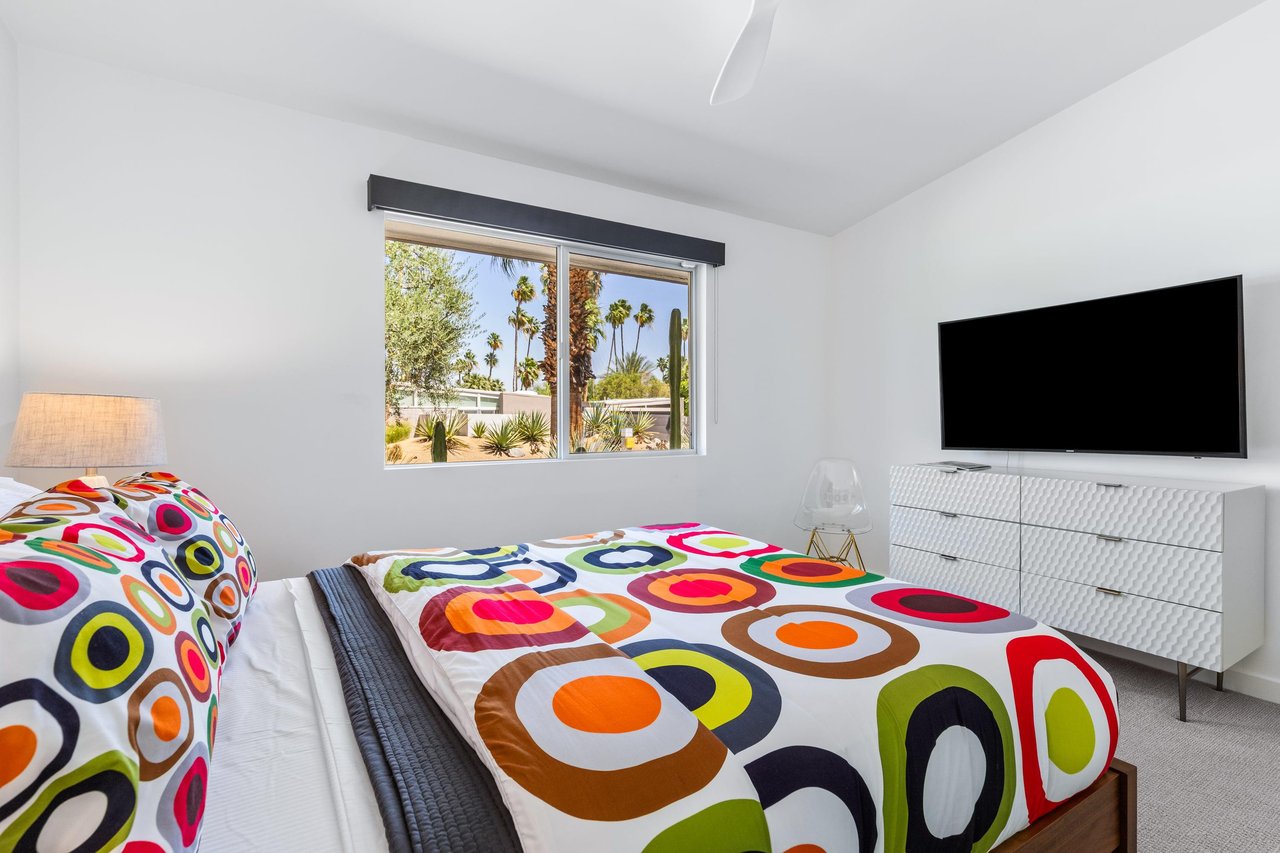 Equipped with a flatscreen TV and plenty of clothing storage.