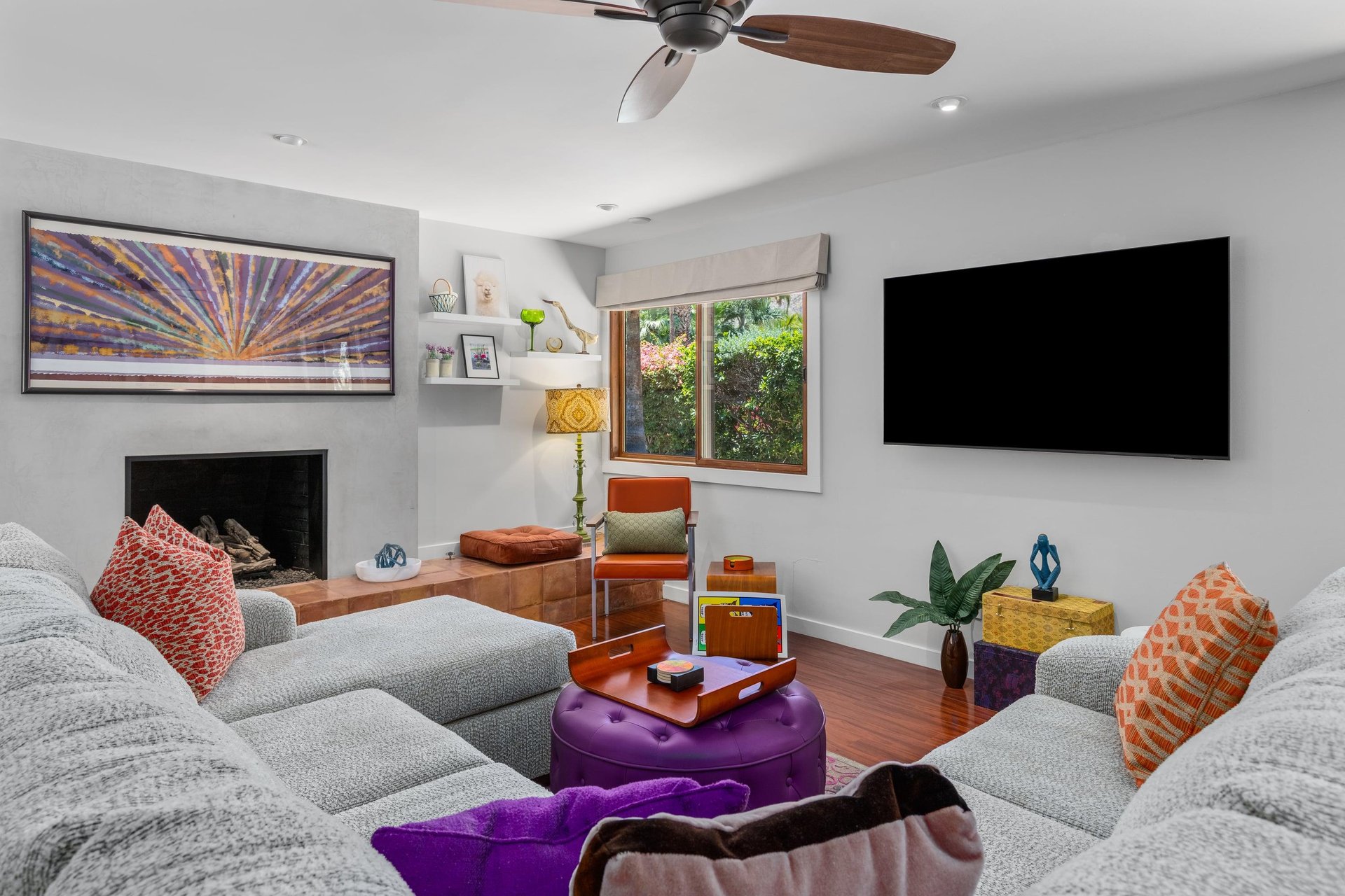 Large sectional couch, fireplace, and smart TV.