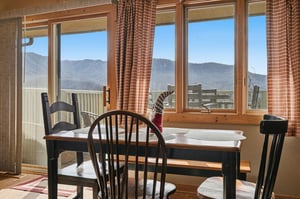 Enjoy breathtaking mountain views while sharing meals at your cozy dining table, with alpine peaks stretching endlessly beyond your windows.
