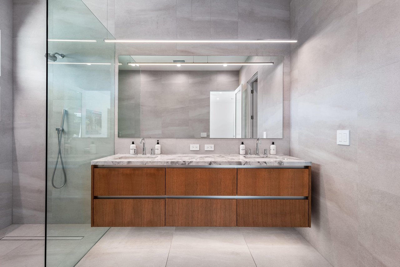 Dual sink vanity in this huge guest bathroom