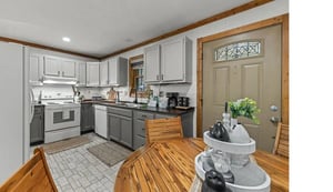 Your fully equipped kitchen features modern appliances and warm wood accents, perfect for preparing homecooked meals during your stay.