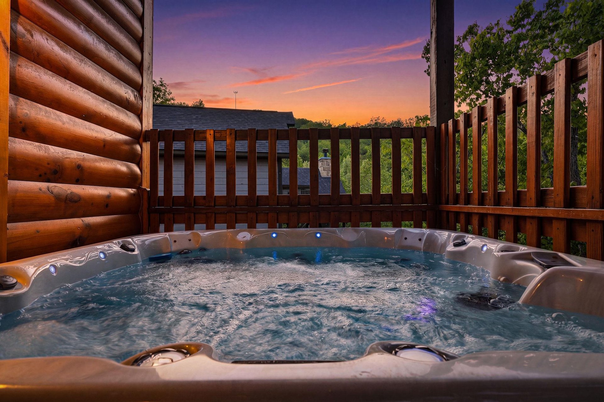 Soak in your private hot tub as the sky transforms into brilliant sunset colors, creating the perfect evening retreat.
