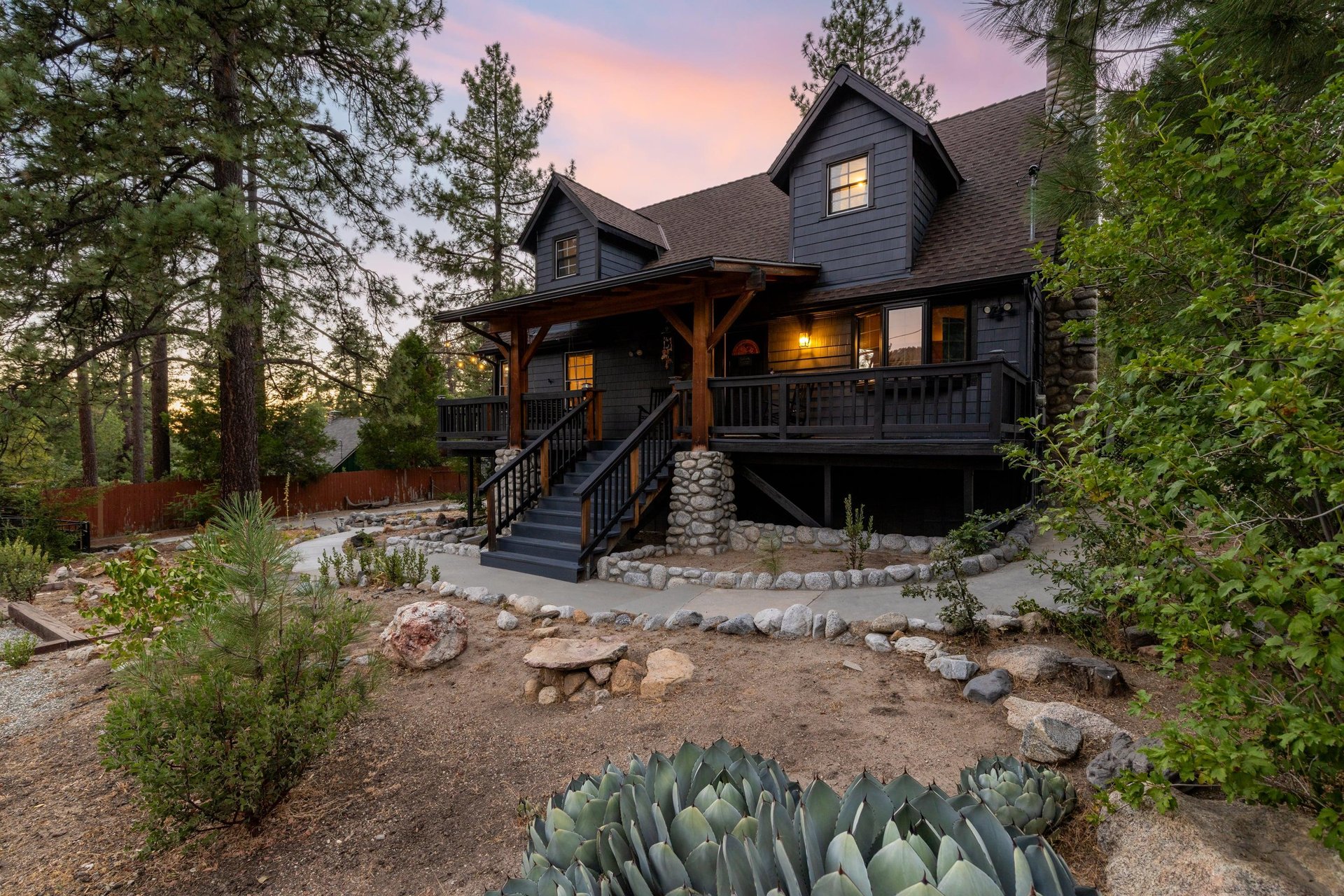 A stunning 4 bedroom, 3 bathroom Idyllwild retreat with a wraparound deck, private hot tub, and more