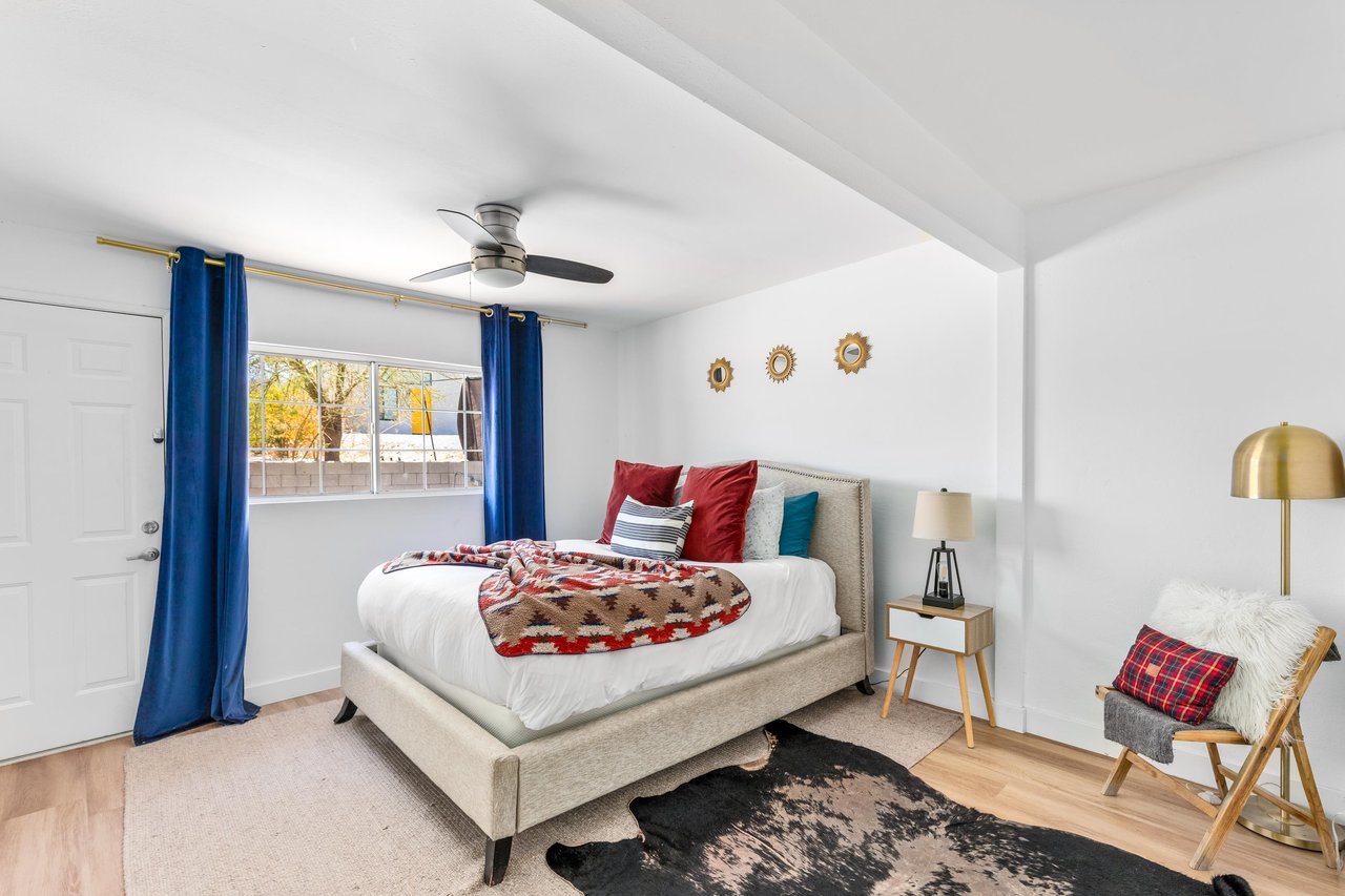 Queen size bed and direct access to outdoor space.