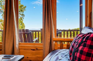 Wake up to sweeping mountain views from your cozy bedroom, where natural light and fresh air invite you to start the day feeling refreshed and inspired.