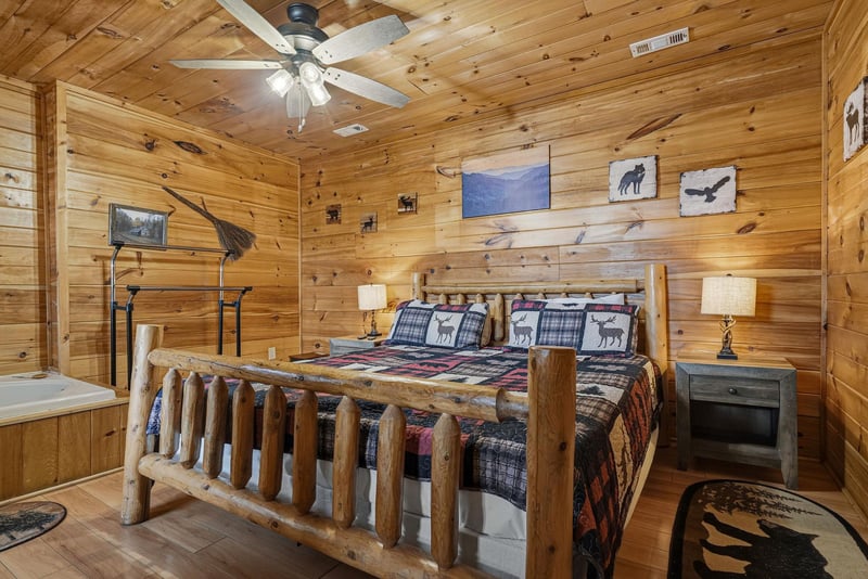 Sink into rustic charm with this cozy log cabin bedroom featuring a handcrafted log bed and wildlifethemed decor that creates your perfect mountain retreat.