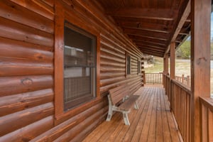 Bench on the deck at Hibernation Station, a 3bedroom cabin rental located in Pigeon Forge