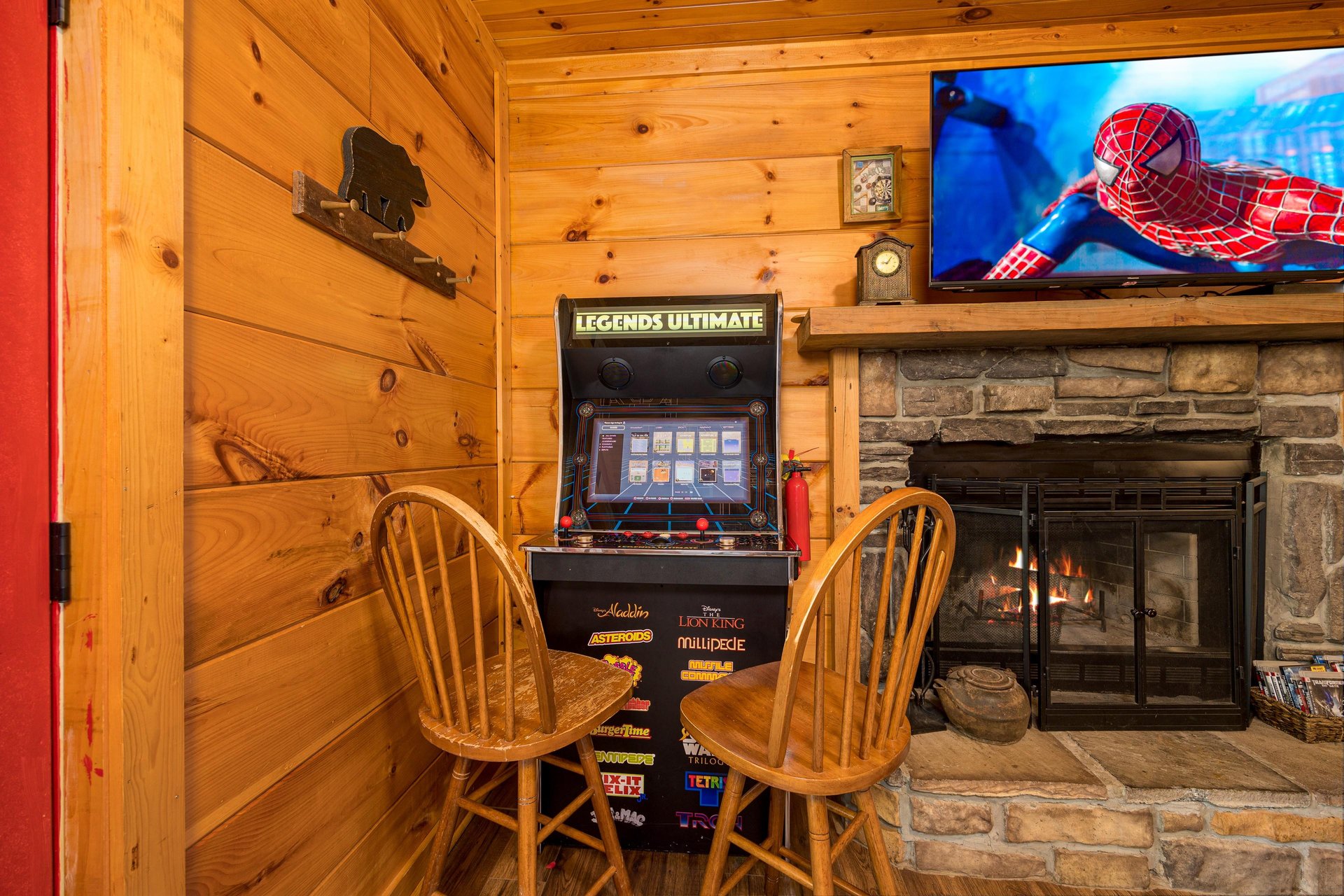 Arcade game by stone fireplace