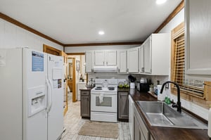 Your fully equipped kitchen awaits with modern appliances, ample counter space, and everything you need to create delicious homecooked meals during your stay.
