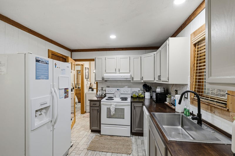 Your fully equipped kitchen awaits with modern appliances, ample counter space, and everything you need to create delicious homecooked meals during your stay.