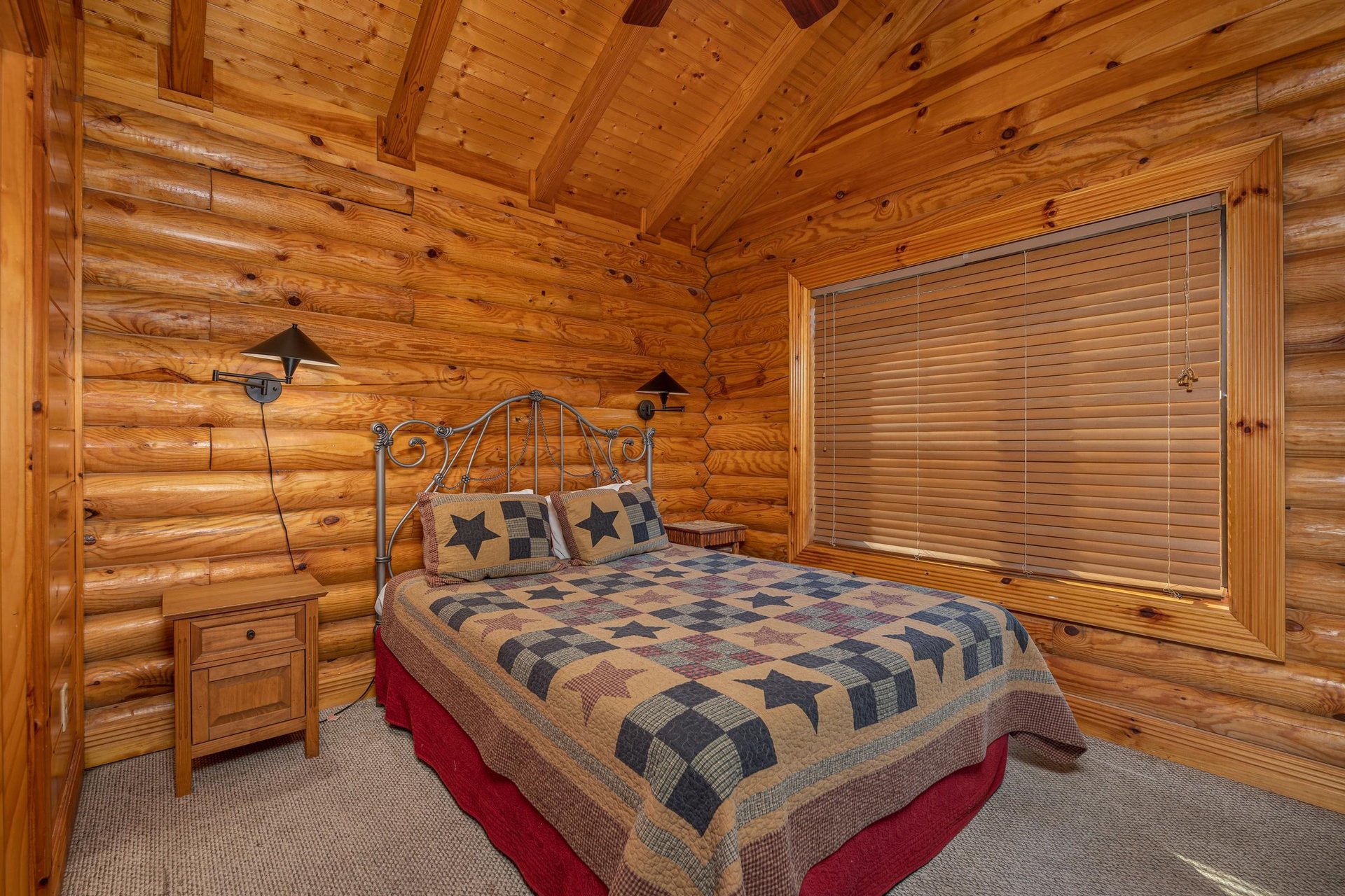 Bedroom with two night stands at Gone Fishin, a 2bedroom cabin rental located in Pigeon Forge