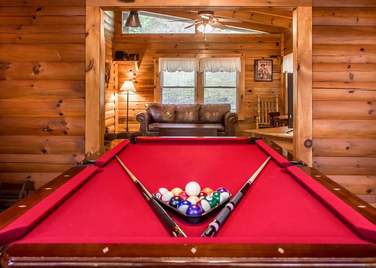 The cabin boasts a pool table, providing hours of entertainment for guests of all ages.