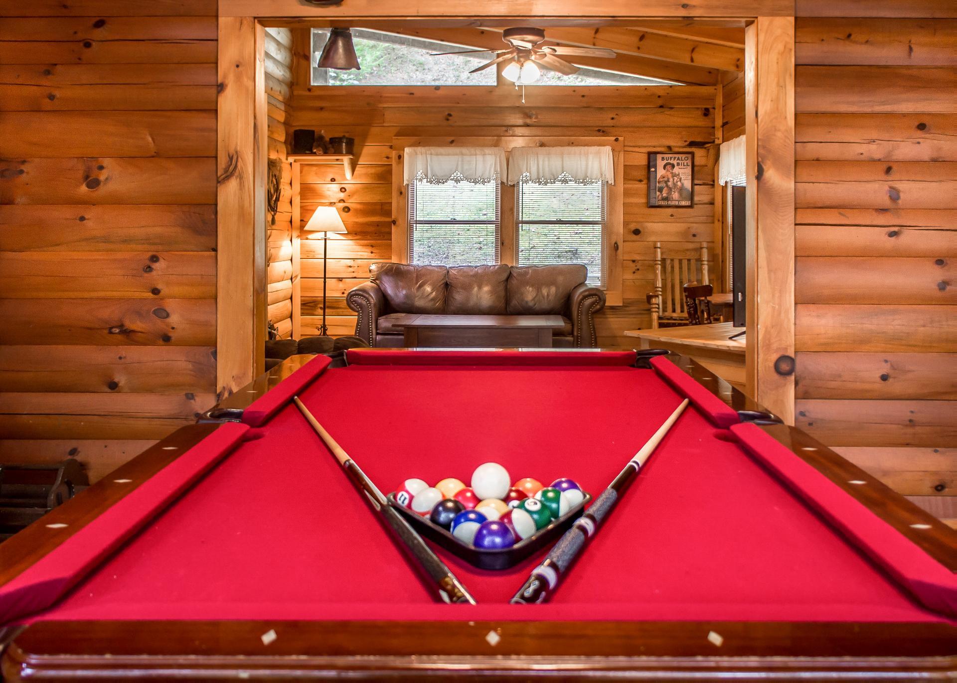 The cabin boasts a pool table, providing hours of entertainment for guests of all ages.