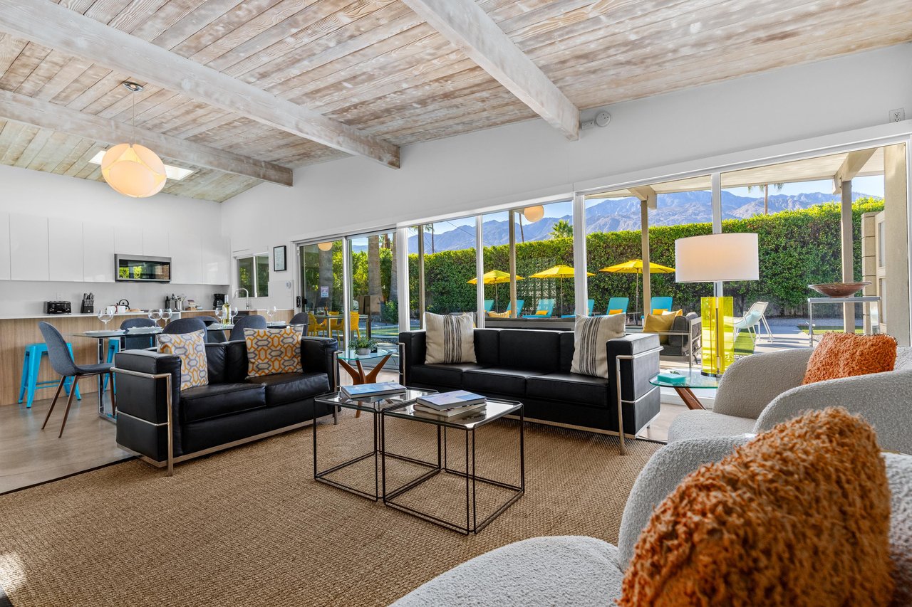Relax in your bright living space with stunning mountain views, cozy seating, and seamless indooroutdoor flow to the pool area.