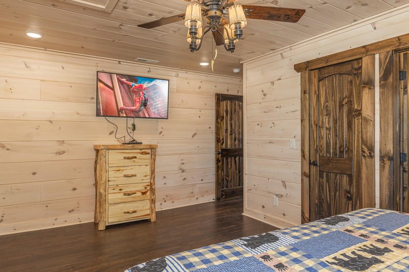 King bed facing dresser and tv