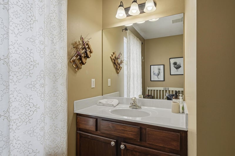 Step into your bright, inviting bathroom with a spacious vanity, elegant fixtures, and thoughtful touches that make freshening up a delight.