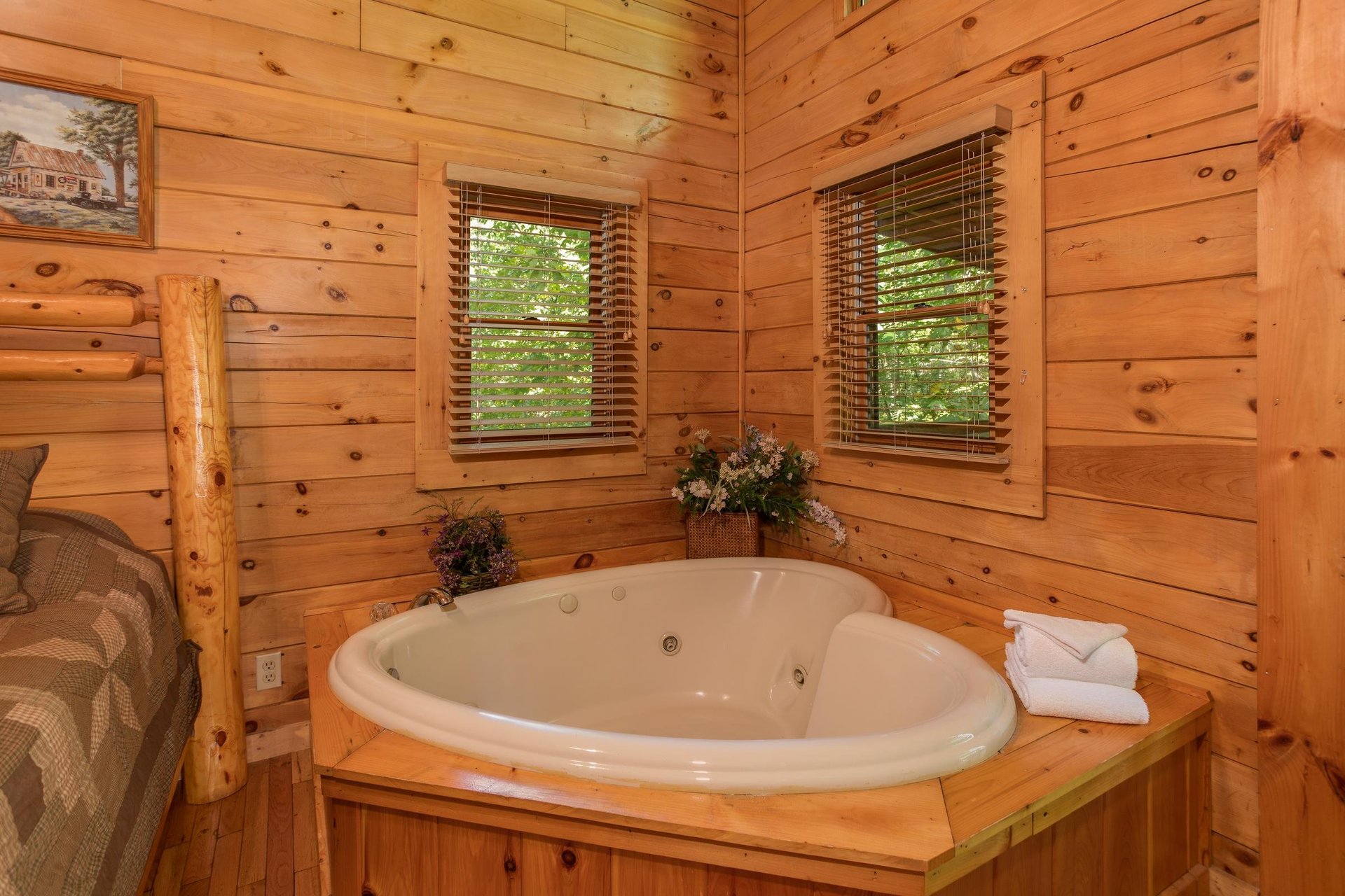 Heartshaped jacuzzi in a bedroom at Dreams Do Come True, a 1bedroom cabin rental located in Pigeon Forge