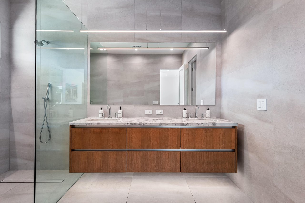 Dual sink vanity in this huge guest bathroom
