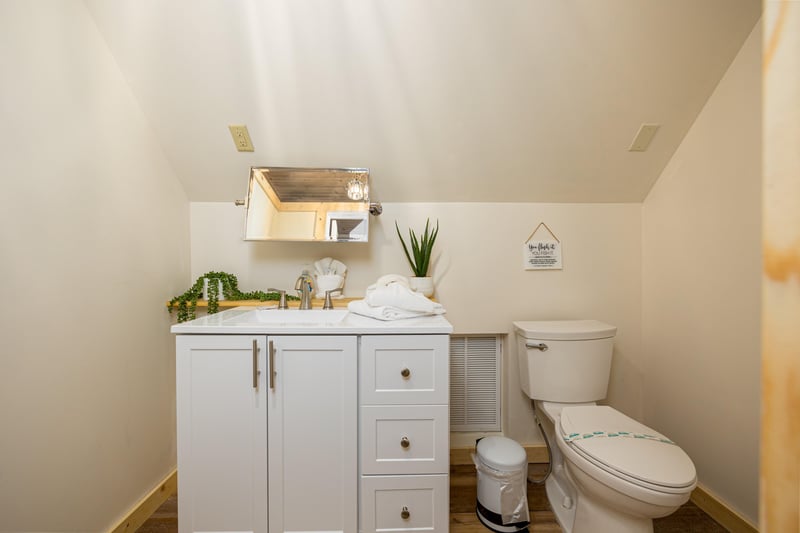 Half bathroom with single vanity sink
