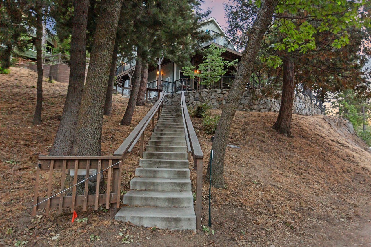 Parking on off the main rd directly across from Lake Gregory with stairs leading to the home.