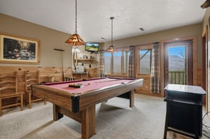Challenge friends to pool while mountain views inspire your next shot through panoramic windows.