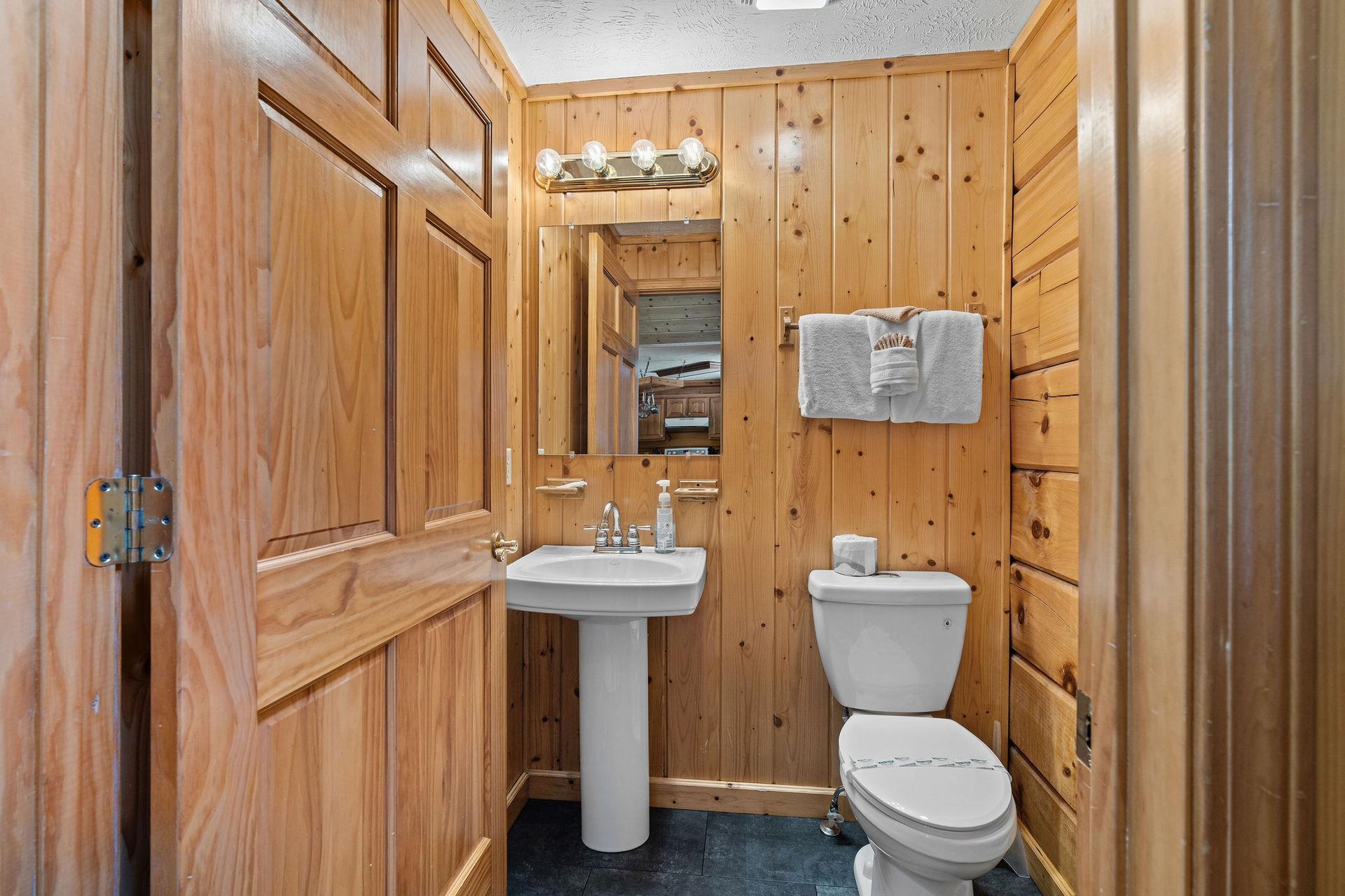 Pedestal sink beside toilet