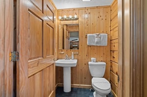 Pedestal sink beside toilet