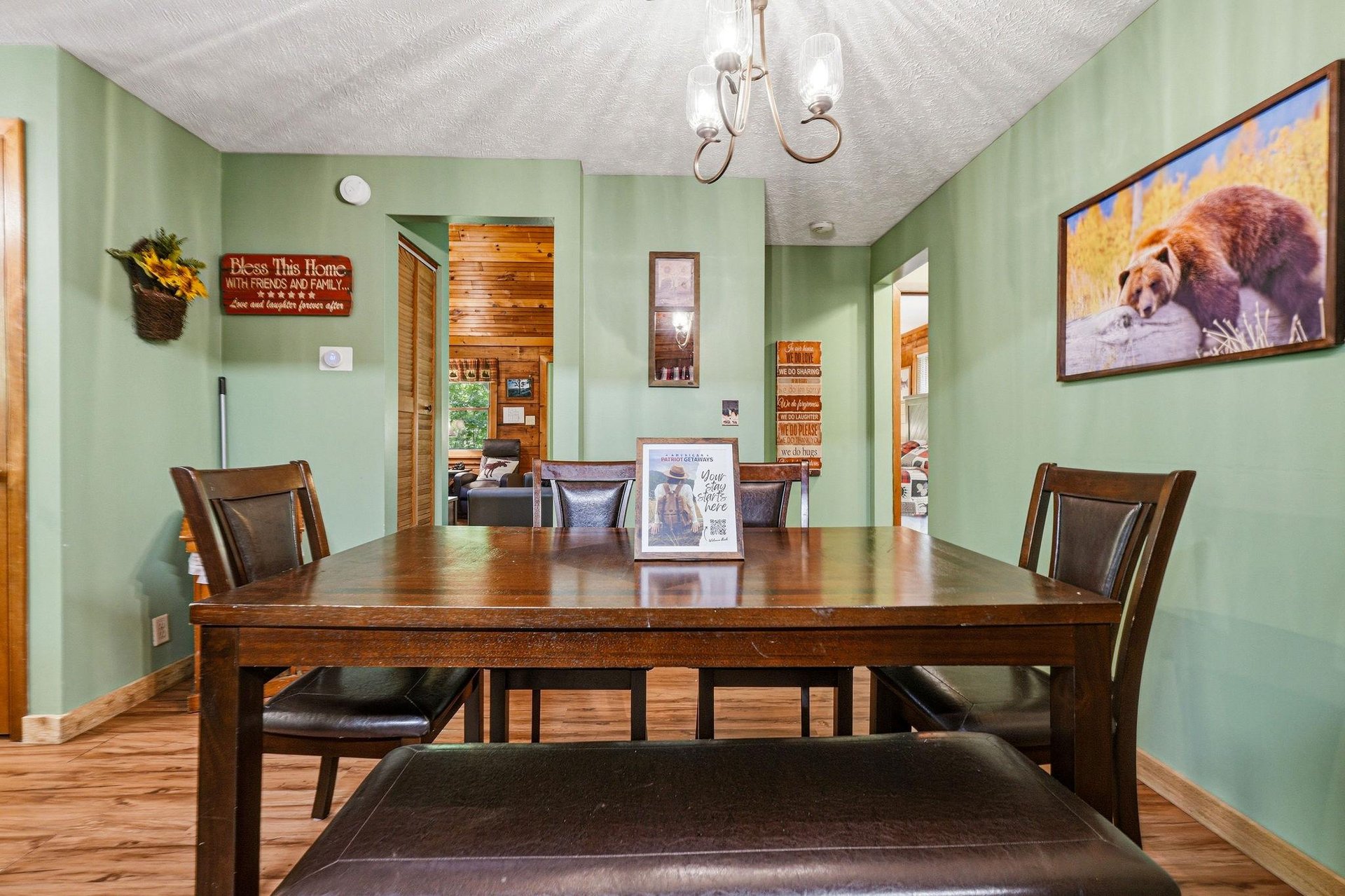 Gather around this welcoming dining table where your group can share stories and create memories together in this cozy, rusticthemed space.