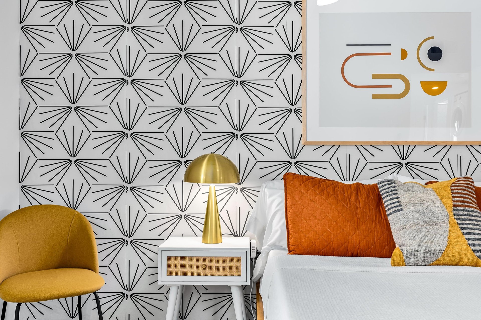 Gold accents adorn this guest bedroom