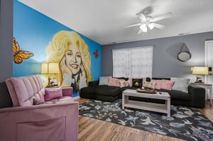 Step into your bright, inviting living room where plush seating and unique décor create a cozy, playful vibe. Unwind on the velvet sofa, gather around the coffee table, and enjoy your private retreat 