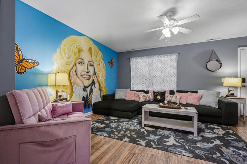 Step into your bright, inviting living room where plush seating and unique décor create a cozy, playful vibe. Unwind on the velvet sofa, gather around the coffee table, and enjoy your private retreat 