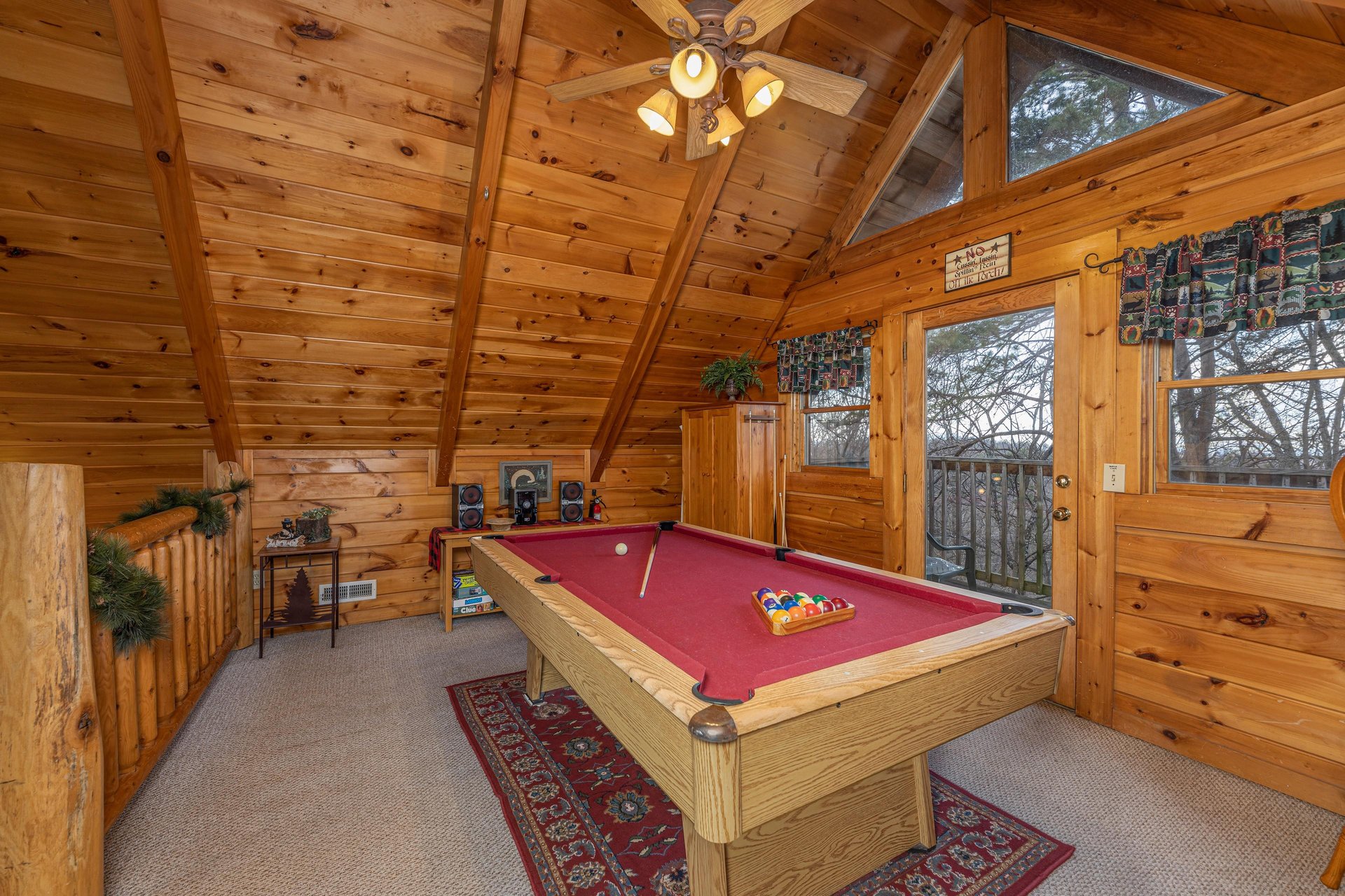 Red felt pool table at A Lovers Secret, a 1 bedroom cabin rental located in Gatlinburg