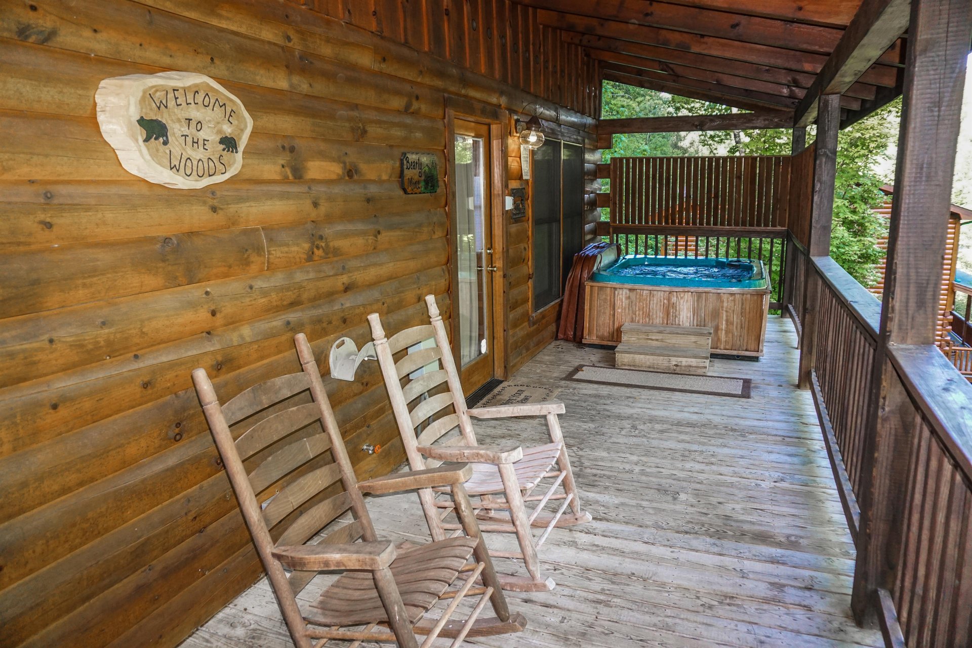 Rocking chairs on the deck at Bearly Mine, a 1bedroom cabin rental in Pigeon Forge