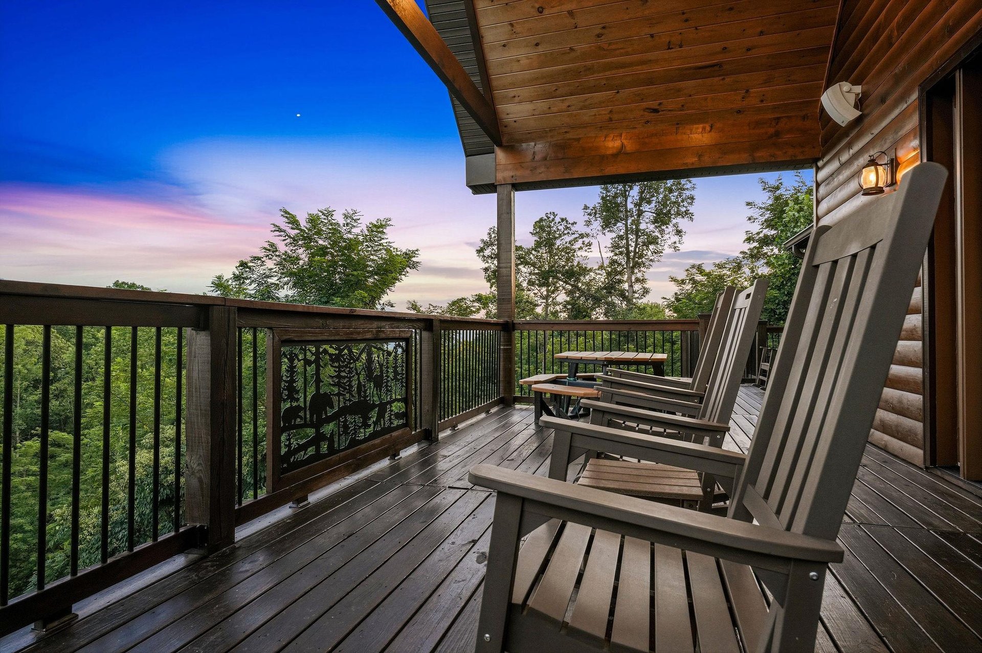 Watch the sky paint itself in brilliant blues and soft pastels from your private deck, where tranquil treetop views and Adirondack seating invite you to unwind completely.