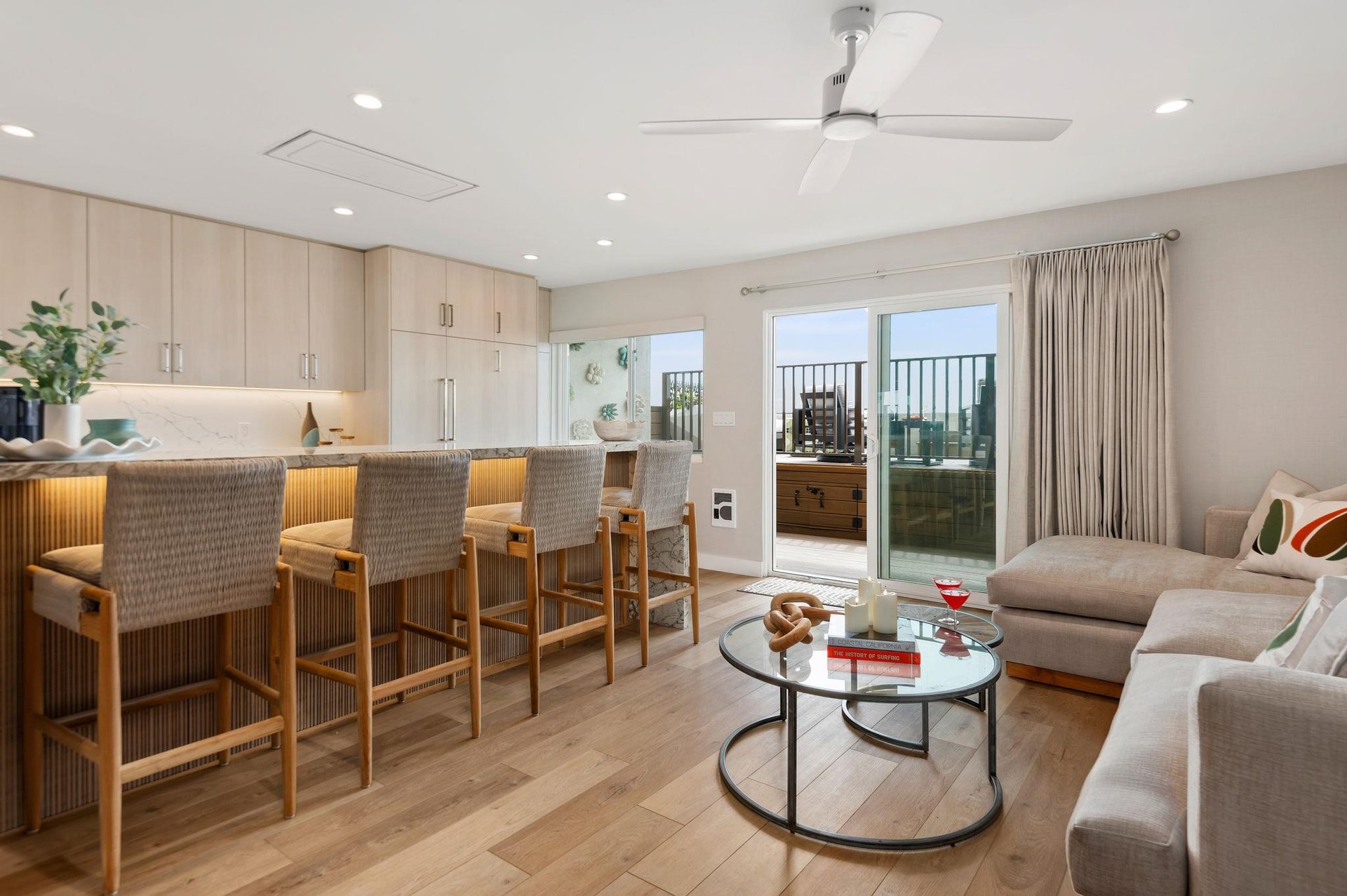 Gorgeous, newly remodeled living room, facing kitchen and breakfast bar.