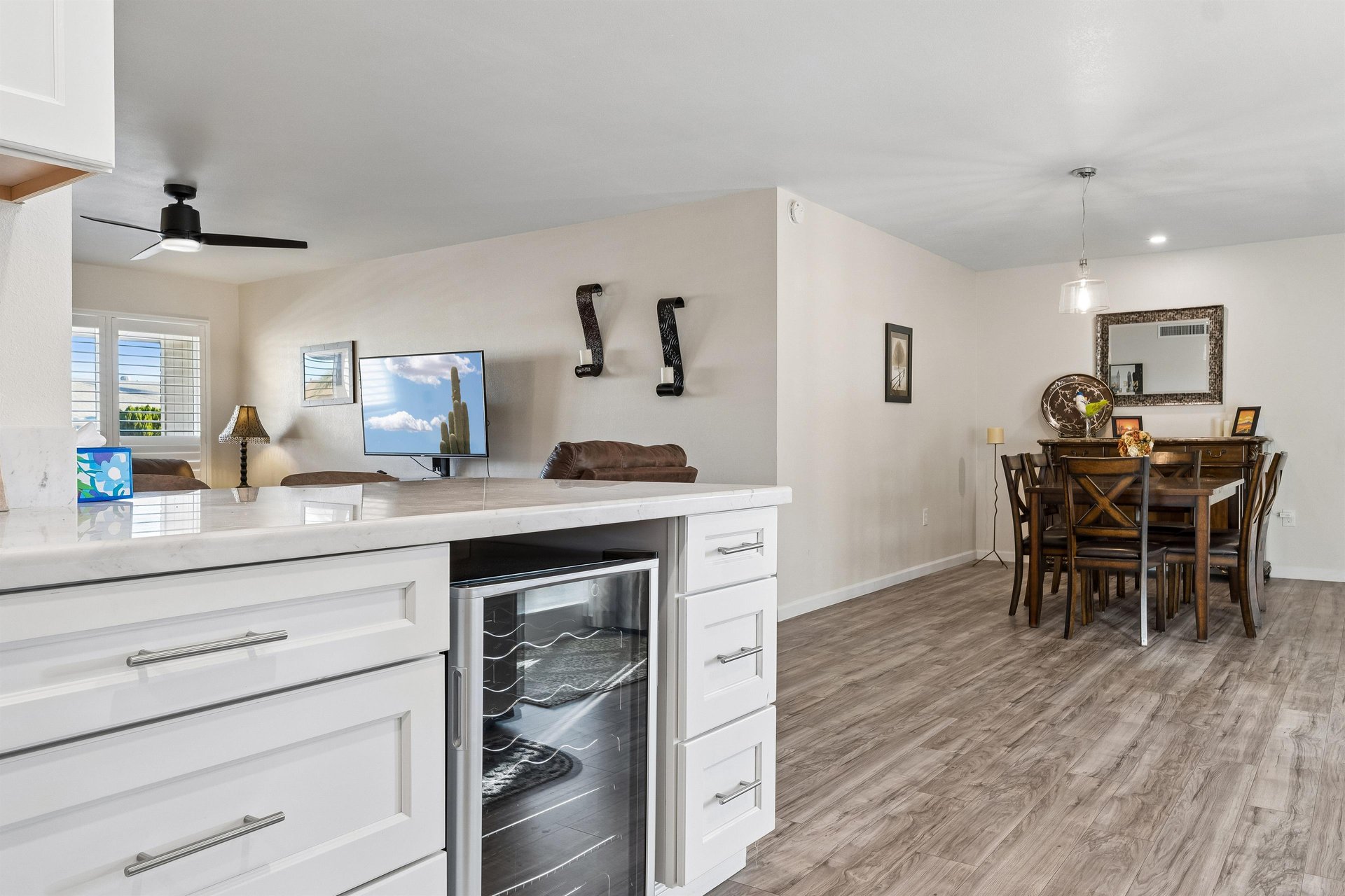 Stainless steel appliances, wine fridge, counter seating for 2, and cooking essentials.