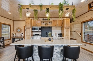 Step into your rusticchic kitchen where modern appliances meet cozy cabin charm. Hanging plants and warm wood create the perfect cooking sanctuary.