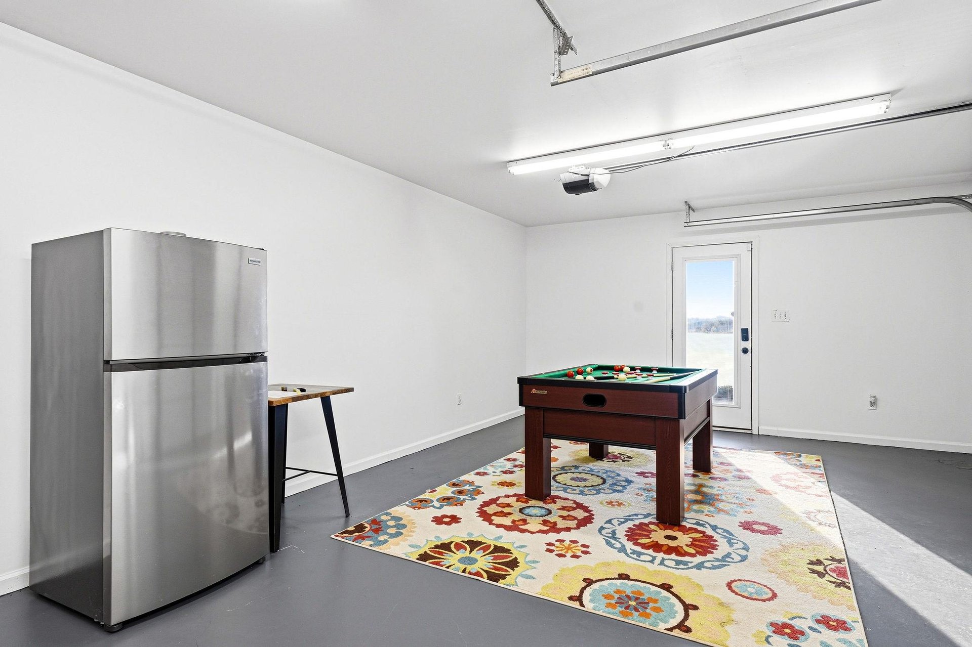 Challenge your friends or family to a friendly match at this billiards table, complete with a mini fridge to keep your drinks cold and refreshing during game time.