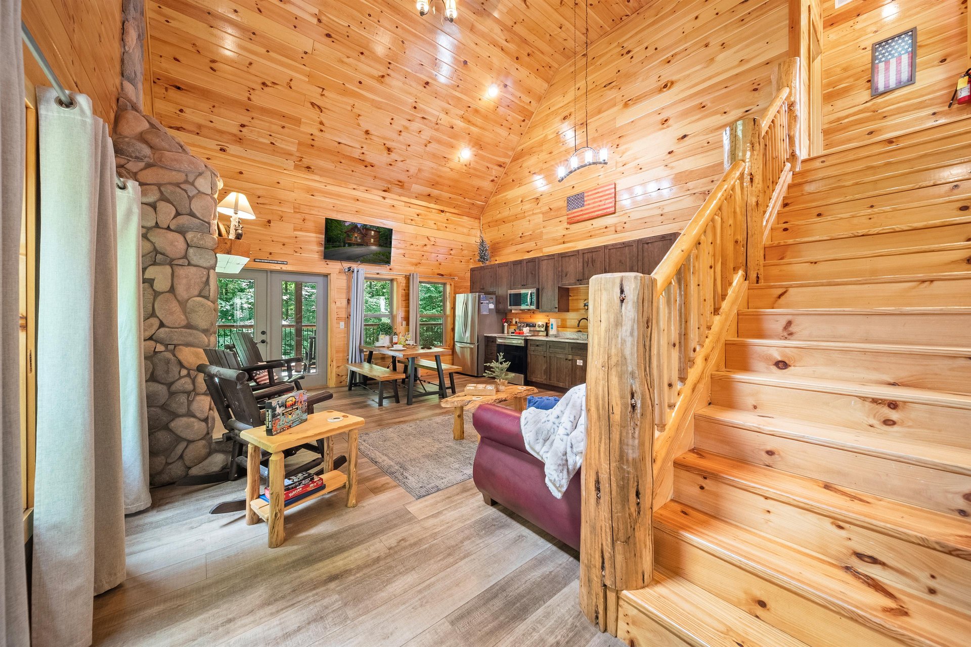 OPEN CONCEPT with a fireplace, sofa bed, dining, natural lighting  views