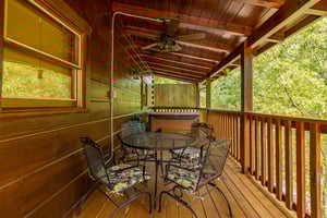 Outdoor dining for 4 at Livin Simple, a 2 bedroom cabin rental located in Pigeon Forge