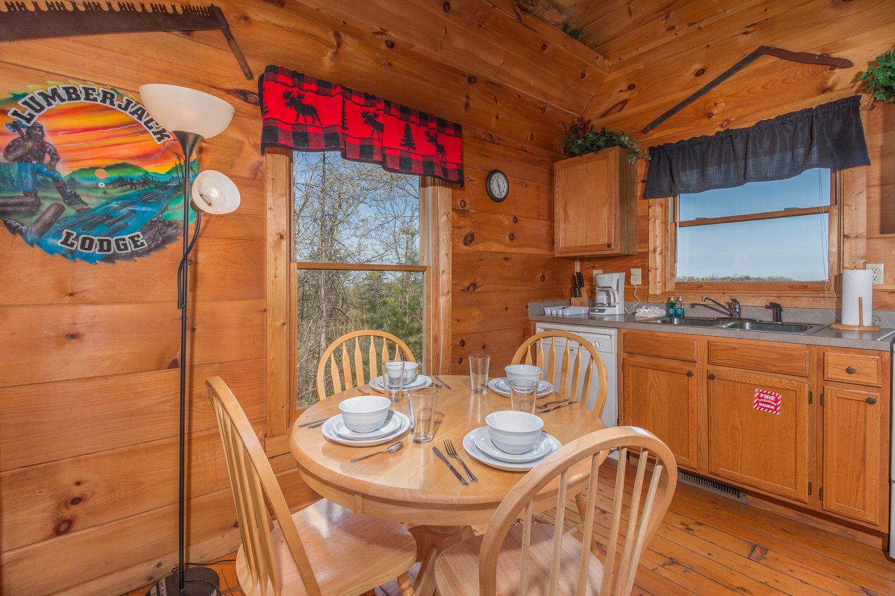 Dining table for four at Lumber Jack Lodge, a 1 bedroom cabin rental located in Gatlinburg