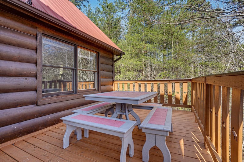 Step onto your private deck and breathe in the fresh mountain air while enjoying meals at your rustic picnic table.
