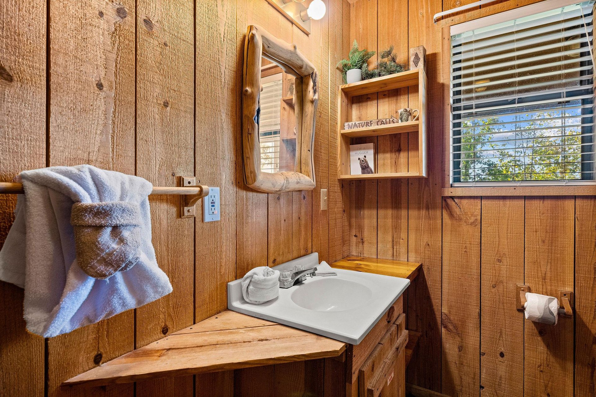 single vanity sink with wood framed mirror