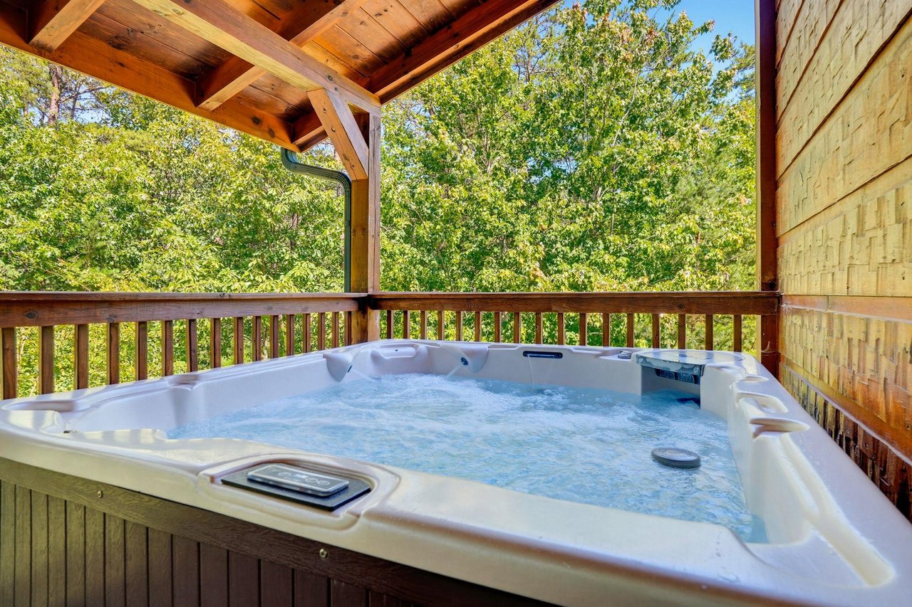Slip into your private hot tub and let the warm water melt away your stress while you gaze at the lush forest surrounding you.