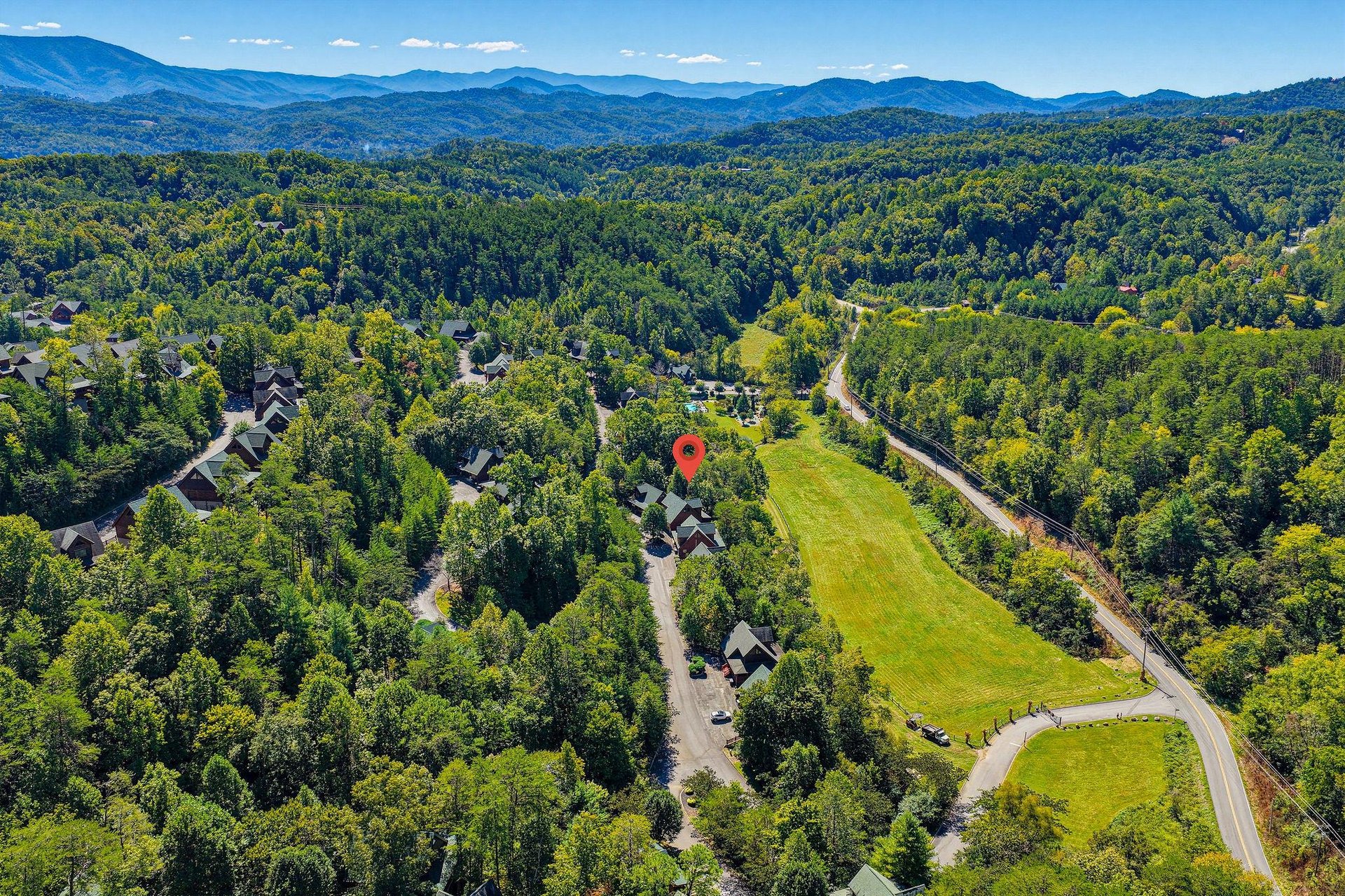 Nestled in a lush mountain valley surrounded by rolling forested peaks, this peaceful retreat offers a serene escape into natures beauty.