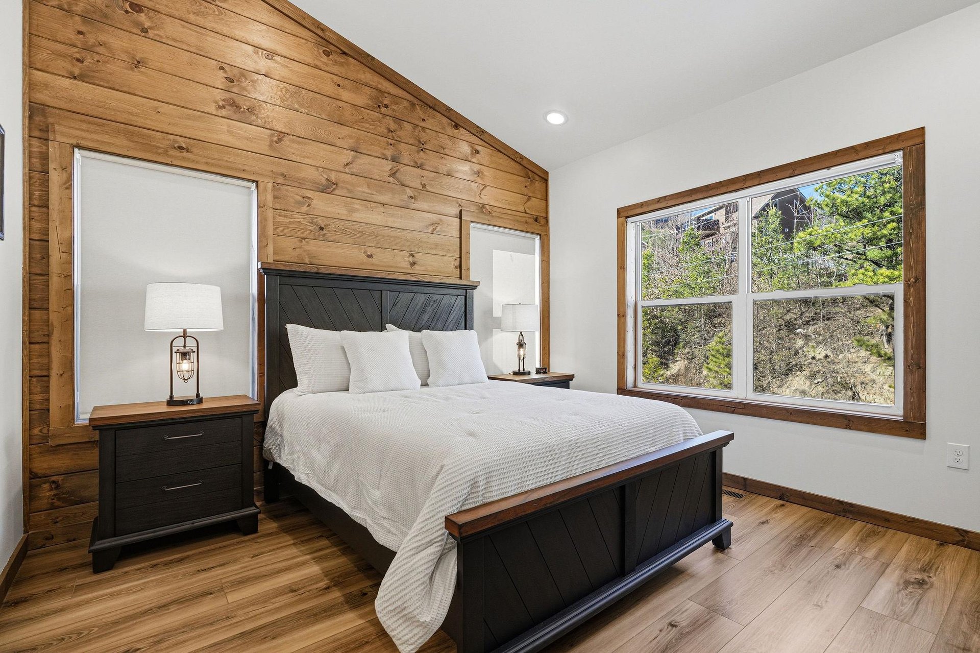 Sink into this cozy bedroom where rustic wood meets modern comfort, your peaceful retreat after mountain adventures.